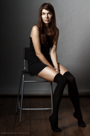 The portrait of the beautiful sexy girl in a black stockings